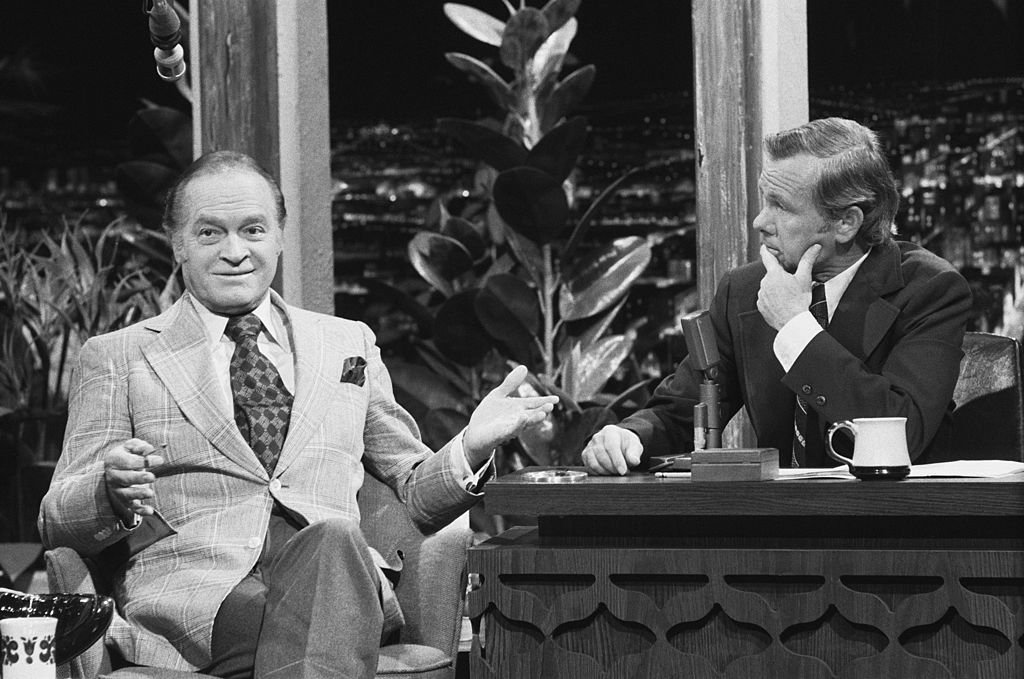 Image Credits: Getty Images / Gary Null / NBCU Photo Bank / NBCUniversal | Comedian Bob Hope, host Johnny Carson.