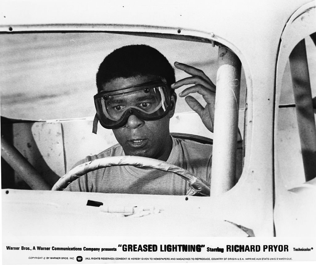 Image Credits: Getty Images / Michael Ochs Archives | Richard Pryor in a scene from the movie "Greased Lightning"