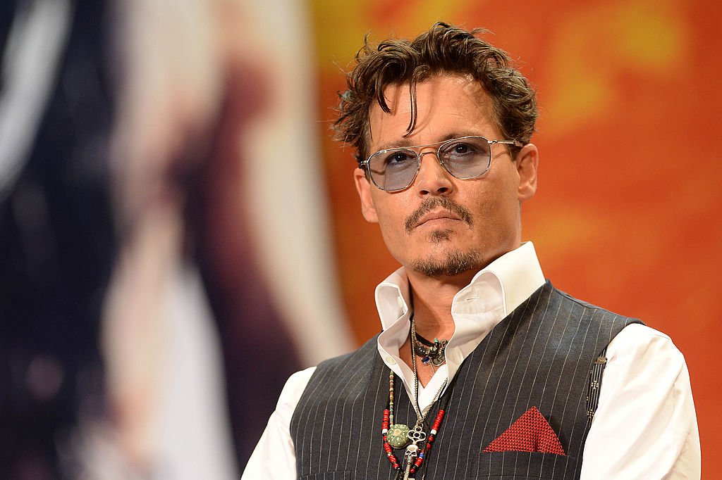 Image Source: Getty Images/Atsushi Tomura | Depp at the Lone Ranger premier