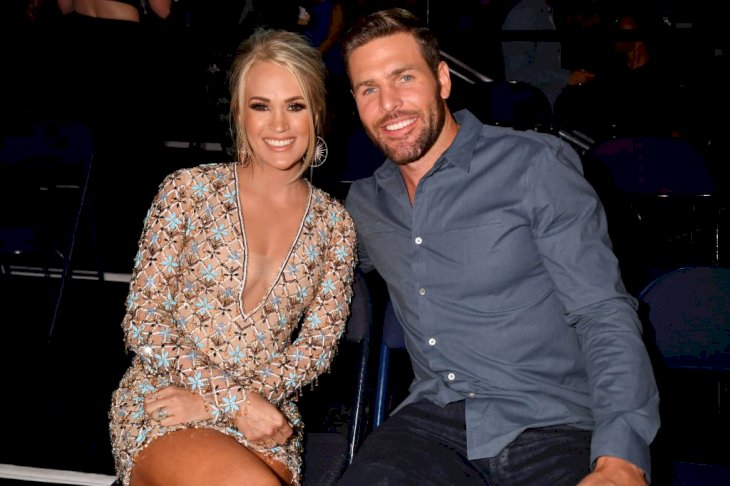 Image Credit: Getty Images/FilmMagic for CMT/Jeff Kravitz | Carrie Underwood and Mike Fisher at the CMT Awards