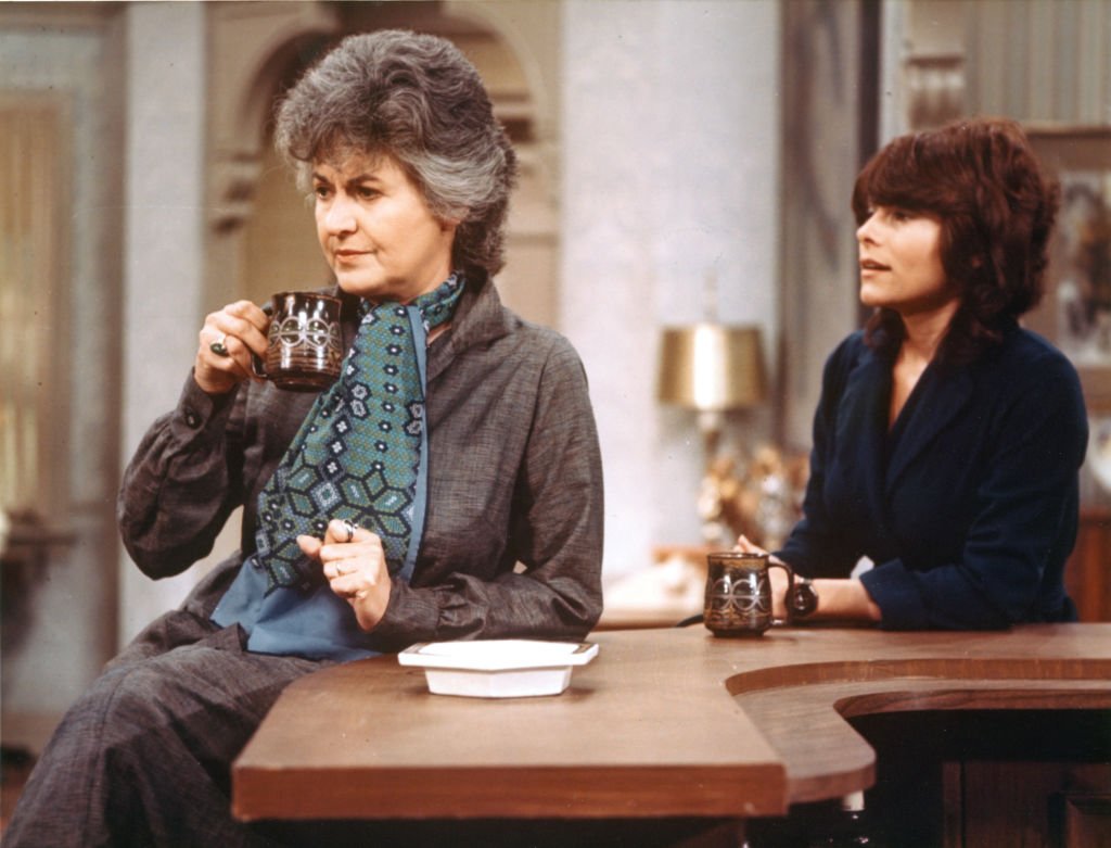 Image Credits: Getty Images / CBS | "Maude" cast members (from left) Beatrice Arthur (as Maude Findlay) and Adrienne Barbeau (as Carol). 1975. Image Credits: Getty Images / CBS | "Maude" cast members (from left) Beatrice Arthur (as Maude Findlay) and Adrienne Barbeau (as Carol). 1975.