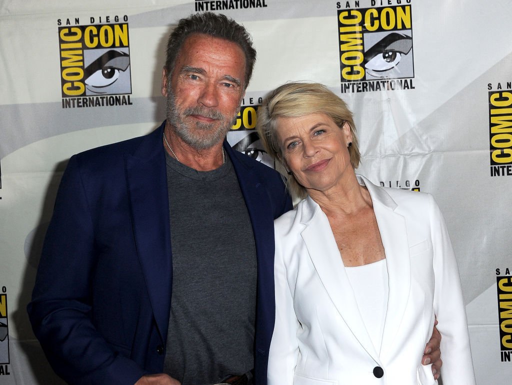 Image Credits: Getty Images / Albert L. Ortega | Arnold Schwarzenegger and Linda Hamilton attend the "Terminator: Dark Fate" panel during 2019 Comic-Con International at San Diego Convention Center on July 18, 2019 in San Diego, California.