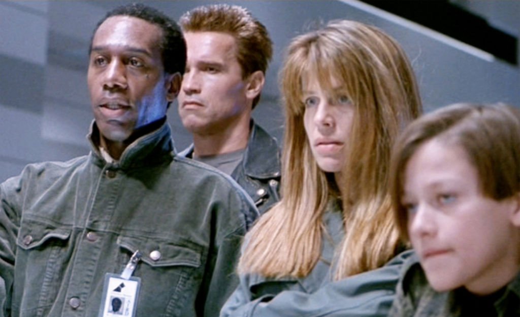 Image Credits: Getty Images / CBS / Paramount Pictures | The movie "Terminator 2: Judgment Day", (alt: T2) directed by James Cameron. Seen here from left, Joe Morton (as Miles Dyson), Arnold Schwarzenegger (as the T-800 Terminator), Linda Hamilton (as Sarah Connor) and Edward Furlong (as John Connor). Theatrical wide release July 3, 1991.