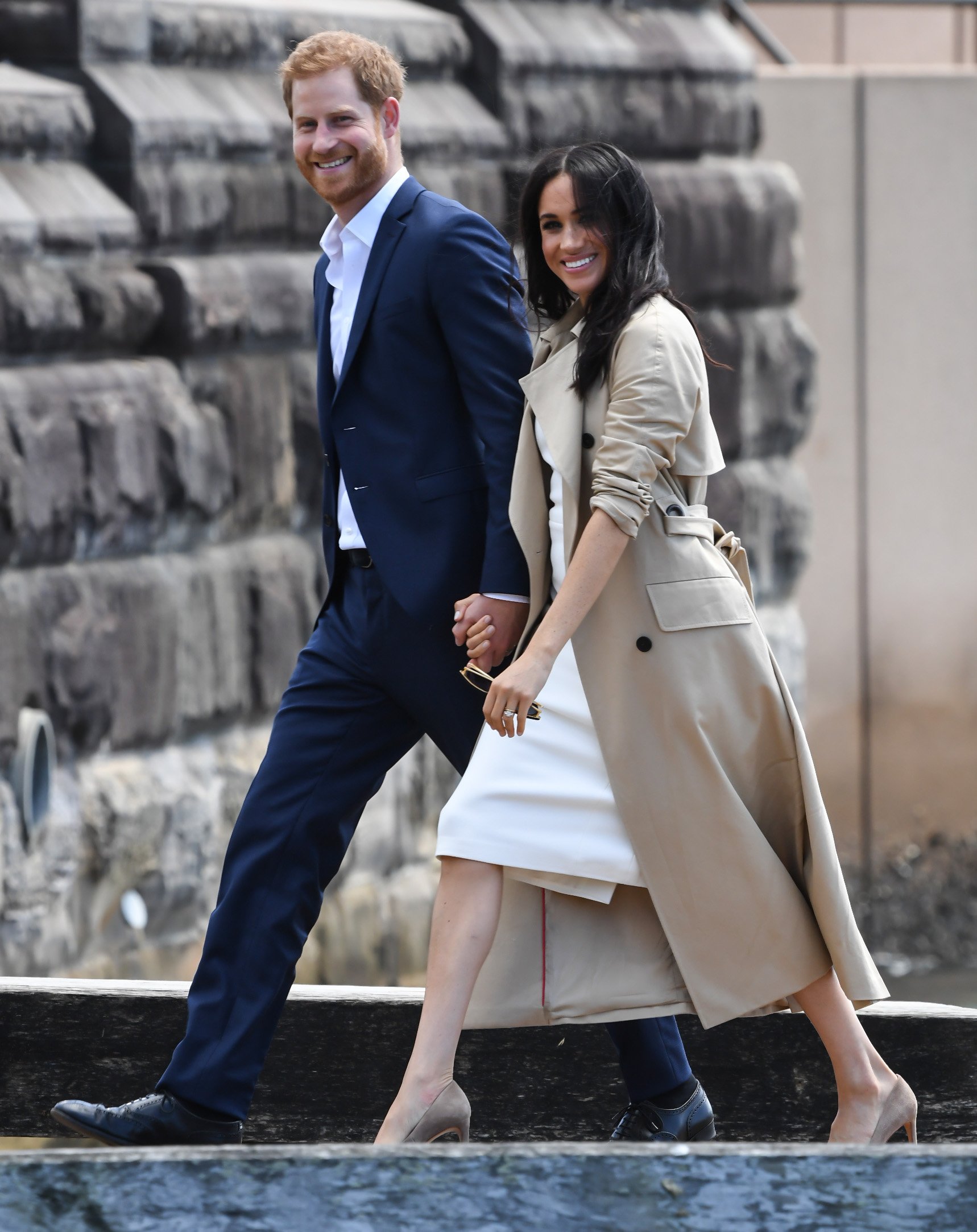 Image Credits: Getty Images / James D. Morgan | Prince Harry, Duke of Sussex and Meghan, Duchess of Sussex arrive at Man o'War Steps, a wharf next to the Opera House on October 16, 2018 in Sydney, Australia. The Duke and Duchess of Sussex are on their official 16-day Autumn tour visiting cities in Australia, Fiji, Tonga and New Zealand.