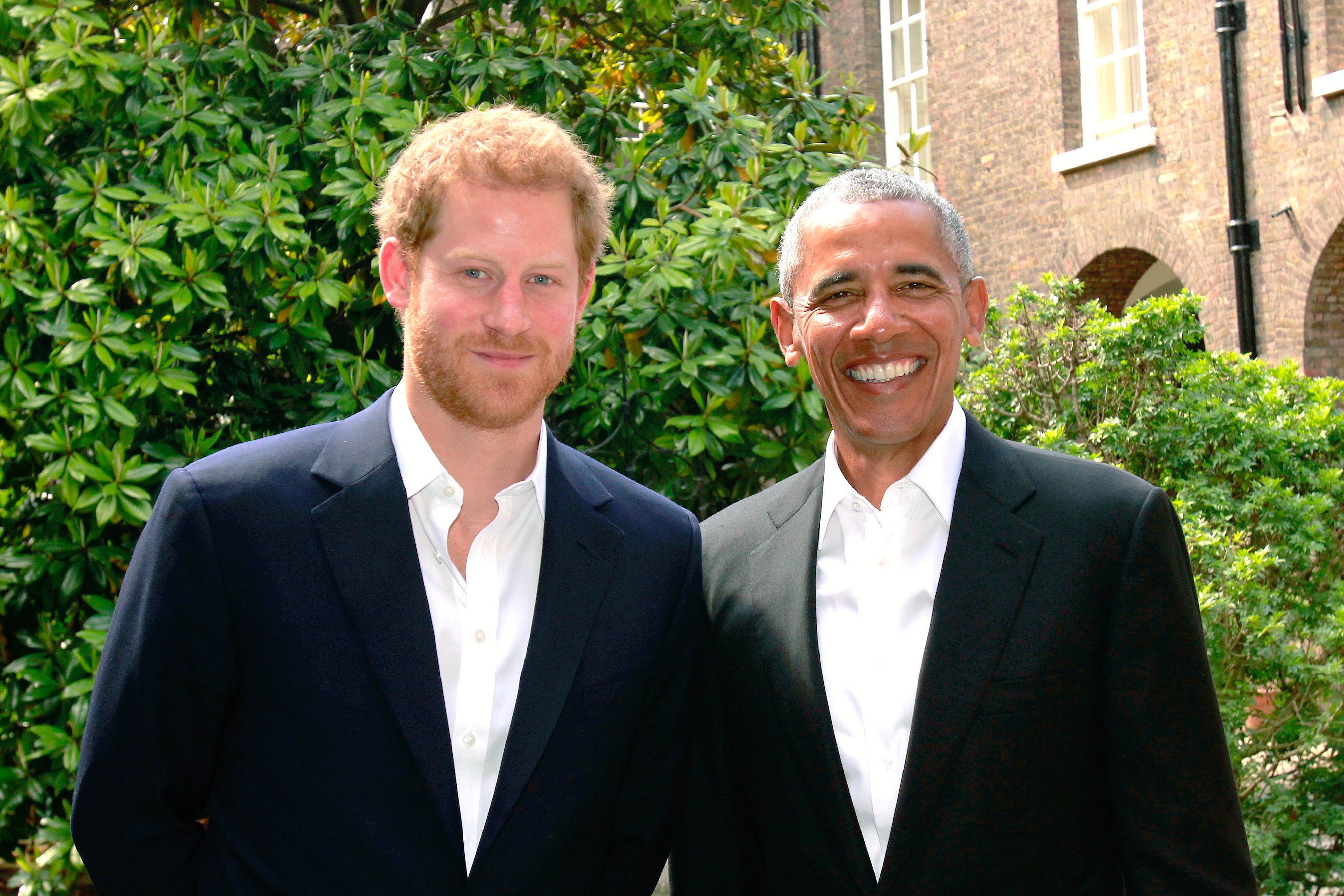 Image Credits: Getty Images / Kensington Palace | In this handout photo issued by Kensington Palace, Prince Harry (left) poses with former US President Barack Obama following a meeting at Kensington Palace on May 27, 2017 in London.