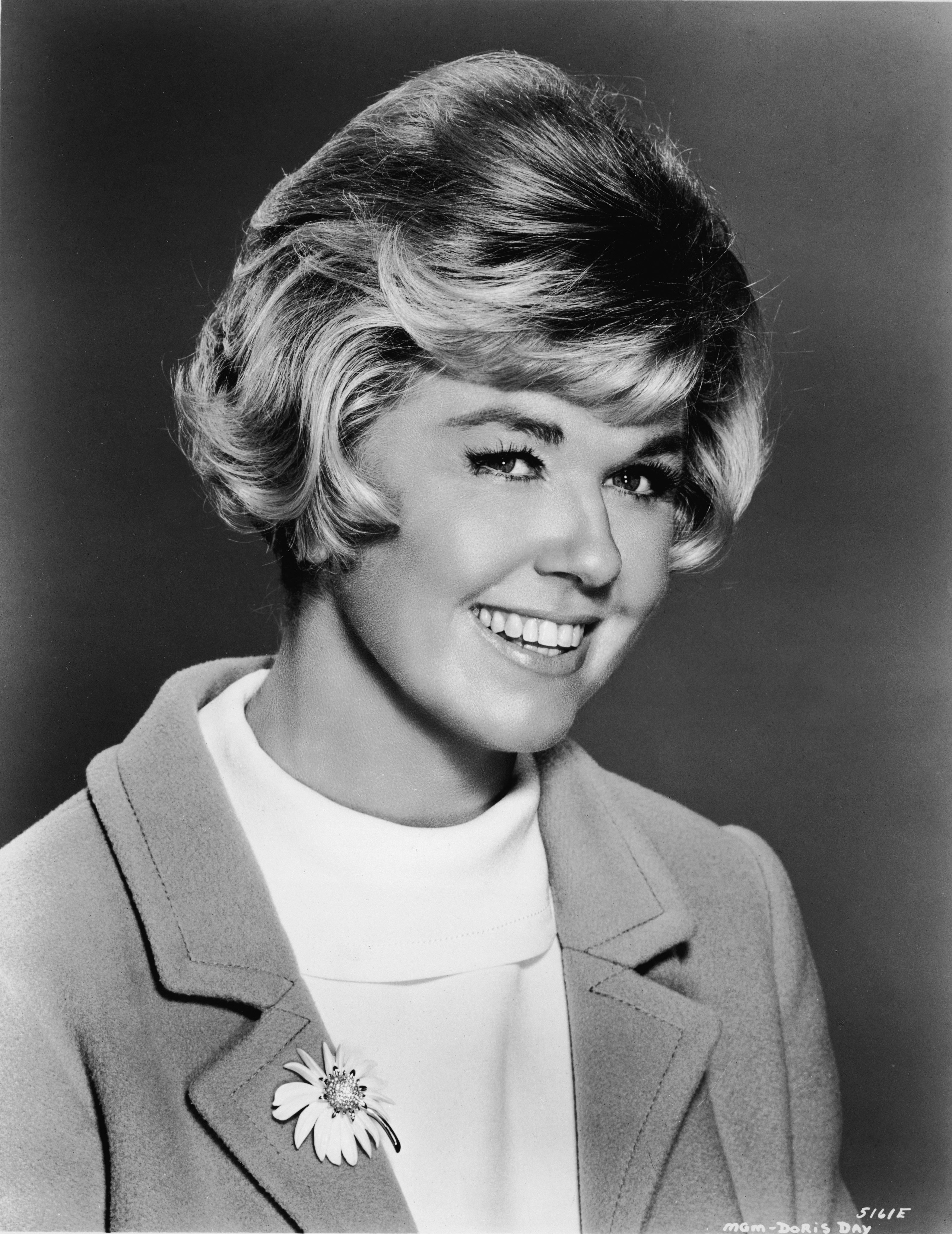 Image Credits: Getty Images / Hulton Archive | Portrait of American movie and television star, singer, and a friend to all the animals Doris Day as she wears a flower brooch, circa 1966.