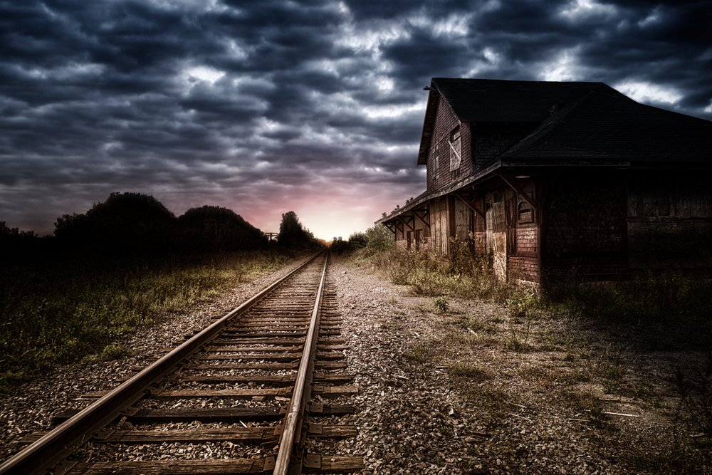 Empty and abandoned train station at night | Shutterstock