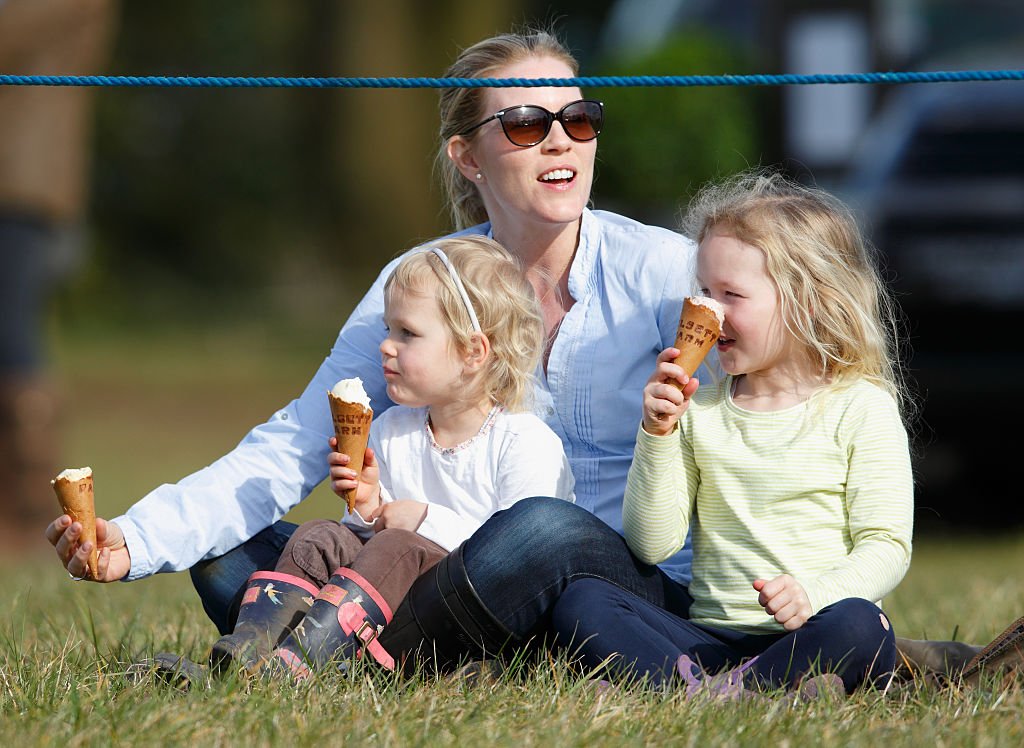 Image Credit: Getty Images / Autumn Phillips and daughters Isla Phillips (l) and Savannah Phillips (r) eat ice creams as they watch the show jumping on March 25, 2016 in Stroud, England. Image Credit: Getty Images / Autumn Phillips and daughters Isla Phillips (l) and Savannah Phillips (r) eat ice creams as they watch the show jumping on March 25, 2016 in Stroud, England.
