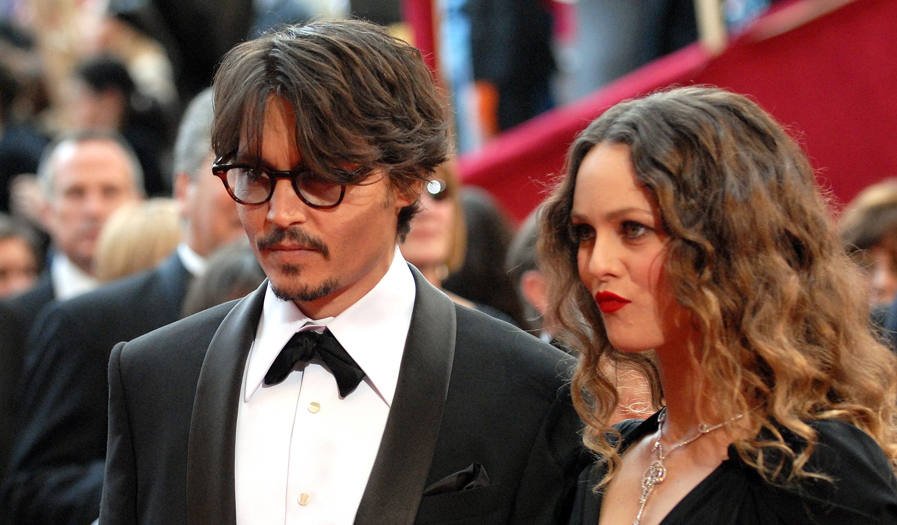 Johnny Depp and Vanessa Paradis arrive at the 80th annual Academy Awards / Getty Images