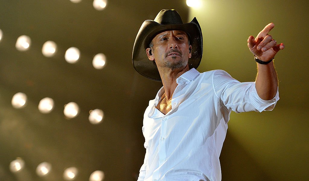 Image Credits: Getty Images / Frederick Breedon IV | Tim McGraw performs during Keith Urban's Fourth annual We're All For The Hall benefit concert at Bridgestone Arena on April 16, 2013 in Nashville, Tennessee. Image Credits: Getty Images / Frederick Breedon IV | Tim McGraw performs during Keith Urban's Fourth annual We're All For The Hall benefit concert at Bridgestone Arena on April 16, 2013 in Nashville, Tennessee.