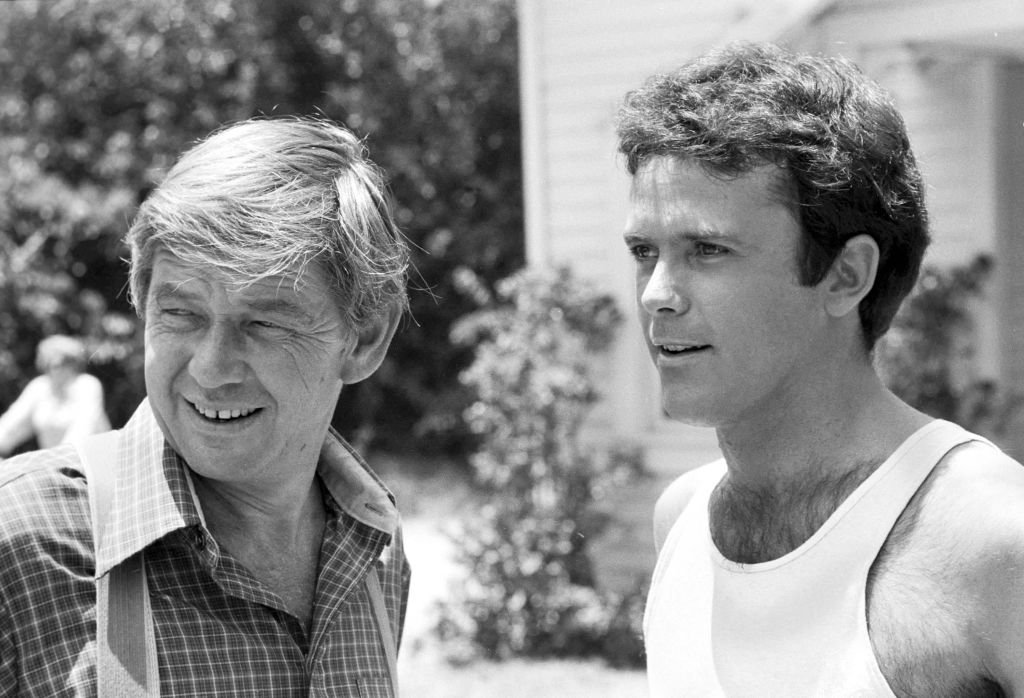 Image Credits: Getty Images / CBS | Ralph Waite as John Walton and Peter Fox as Rev. Hank Buchanan in the episode 'The Hawk', in the CBS television series "The Waltons," July 1, 1977.