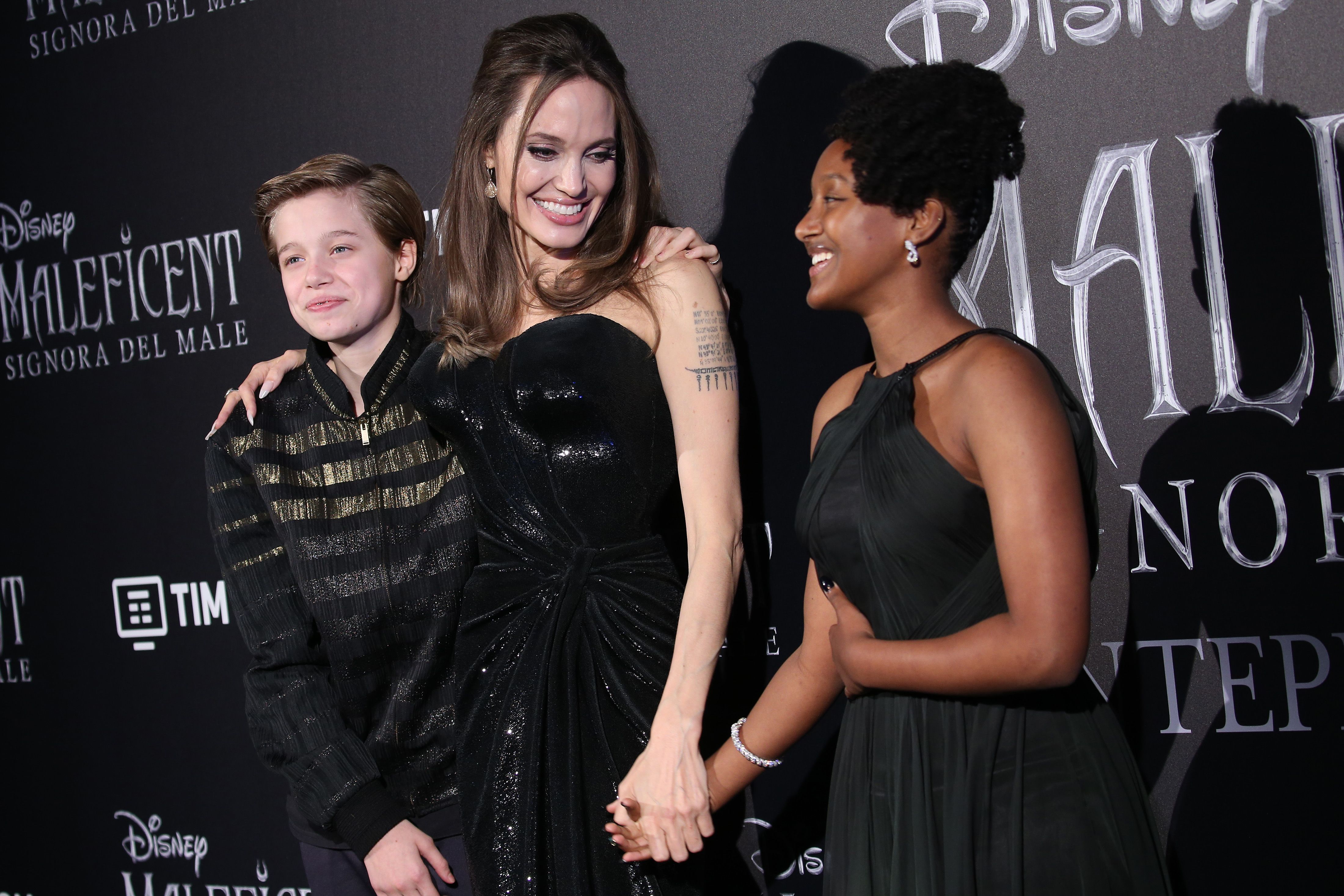Angelina Jolie with her eldest daughters / Getty Images