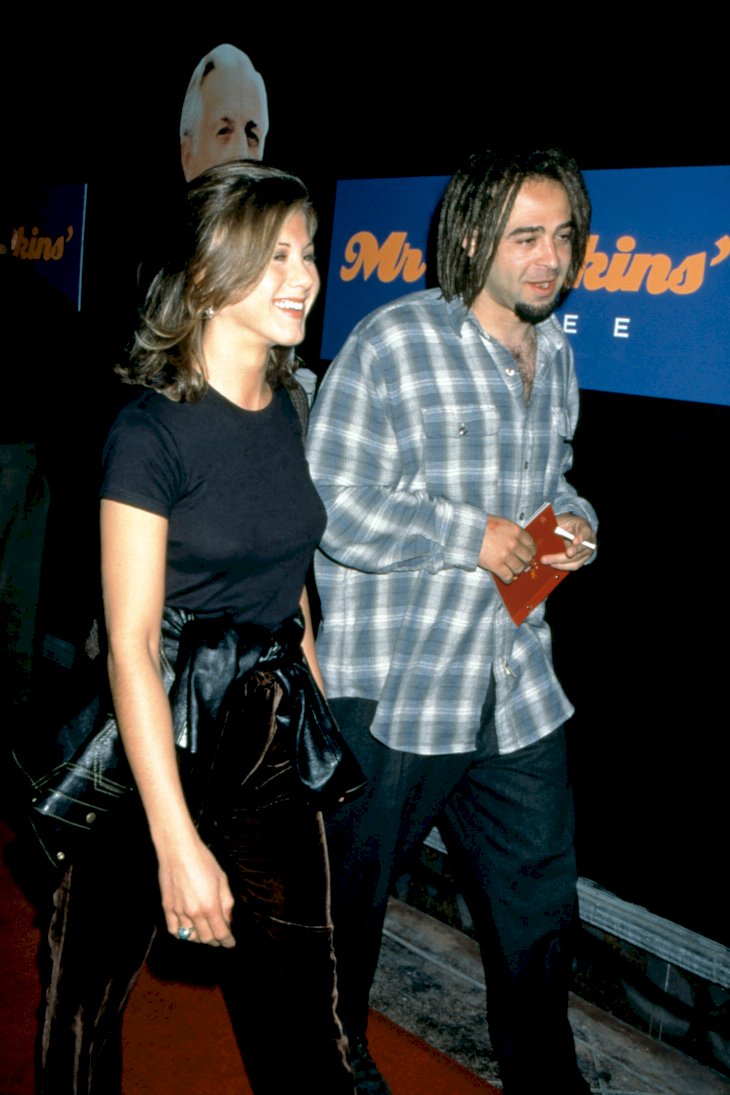 Image Credit: Getty Images/Ron Davis | Jennifer Aniston and American musician Adam Duritz attend the "Mr. Jenkins Soiree"
