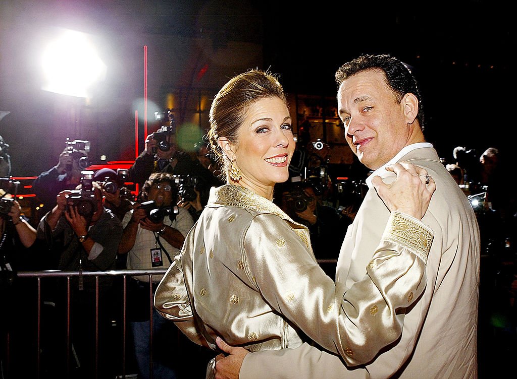 Image Credits: Getty Images / Carlo Allegri | Actor Tom Hanks (R) and actress Rita Wilson (L) arrive for the world premiere of the movie 'Ladykillers' at the El Capitan Theatre March 12, 2004 in Hollywood, CA. The movie goes into wide release on March 26th, 2004.