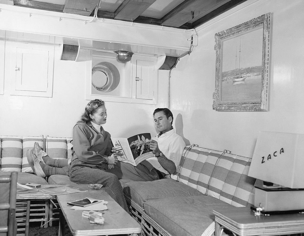 Image Source: Getty Images/George Rinhart/Errol Flynn and his wife, Nora Eddington, in the lounge of yacht, Zaca