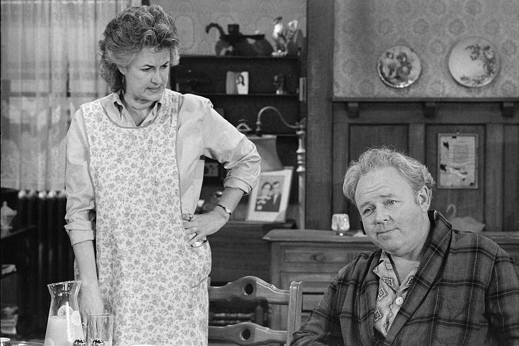 Image Credits: Getty Images / CBS Photo Archive | American actress Bea Arthur (as Maude Findlay) looks angrily at American actor Carroll O'Connor (1924 - 2001) (as Archie Bunker) in a scene from an episode of the controversial CBS sitcom 'All in the Family' entitled 'Cousin Maude's Visit,' Los Angeles, November 9, 1971. The episode first aired on December 11, 1971. The series, which concerned the domestic antics of O'Connor as a Queens, New York, bigot, aired from 1971 to 1979. Arthur's character got her own spin-off series called 'Maude' which ran from 1972 to 1978. Image Credits: Getty Images / CBS Photo Archive | American actress Bea Arthur (as Maude Findlay) looks angrily at American actor Carroll O'Connor (1924 - 2001) (as Archie Bunker) in a scene from an episode of the controversial CBS sitcom 'All in the Family' entitled 'Cousin Maude's Visit,' Los Angeles, November 9, 1971. The episode first aired on December 11, 1971. The series, which concerned the domestic antics of O'Connor as a Queens, New York, bigot, aired from 1971 to 1979. Arthur's character got her own spin-off series called 'Maude' which ran from 1972 to 1978.