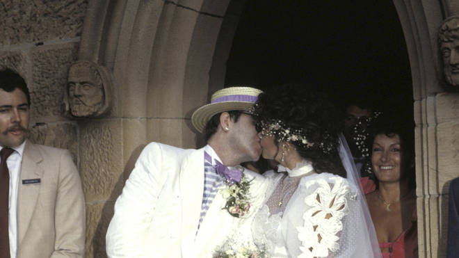 Image Credits: Getty Images / Elton John photographed with his former wife, Renate.