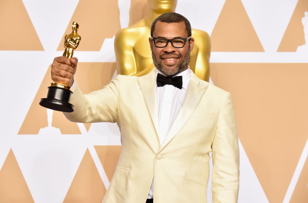 Image Credits: Getty Images / Jeff Kravitz/FilmMagic | Writer Jordan Peele poses in the press room