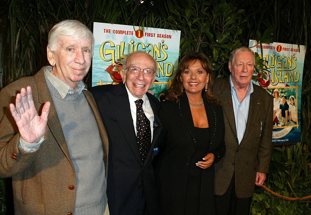 Image Credit: Getty Images / Cast Members (l-r) Actor Bob Denver, Creator of "Gilligan's Island" Sherwood Schwarz Actress Dawn Wells and Actor Russell Johnson arrive at the launch party for "Gilligan's Island: The Complete First Season" on February 03, 2004 in Marina del Rey, California.
