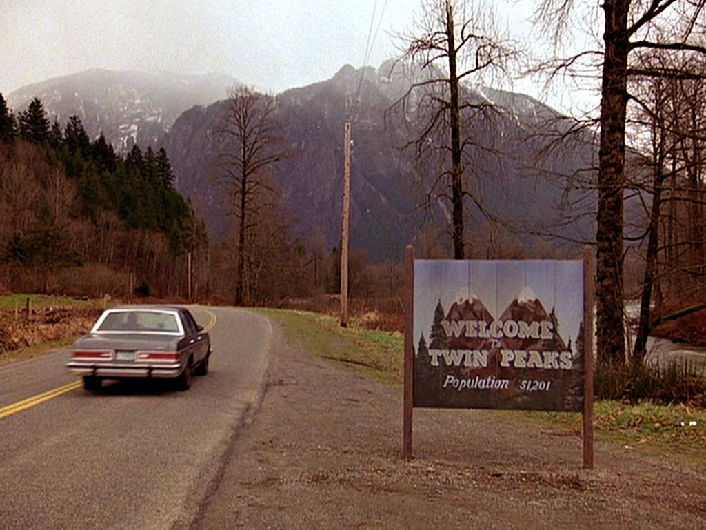Image Credits: Getty Images / CBS Photo Archive | The title scene from the pilot episode of the television series 'Twin Peaks,' originally broadcast on April 8, 1990. It was filmed on Reinig Road in Snoqualmie, Washington.