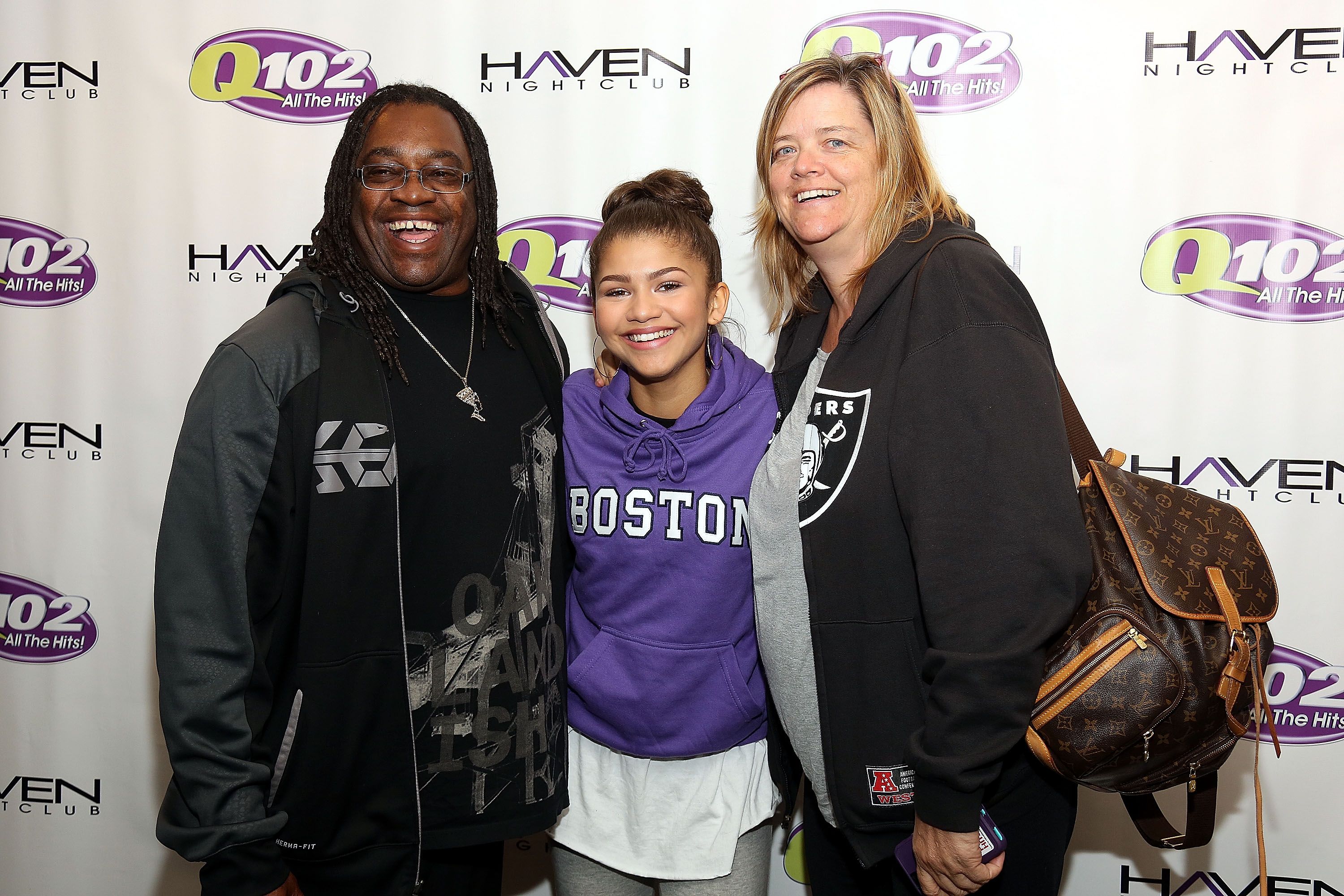 Zendaya Coleman poses with her father Kazembe Ajamu Coleman and mother Claire Stoermer at the Q012 Performance / Getty Images