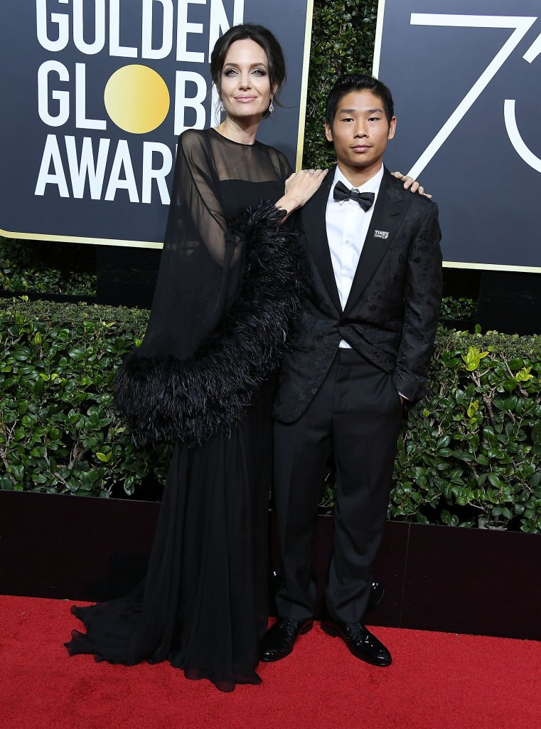 Image Source: Getty Images/Steve Granitz/Angelina Jolie, Pax Thien Jolie-Pitt arrives at the 75th Annual Golden Globe Awards at The Beverly Hilton Hotel on January 7, 2018 in Beverly Hills, California
