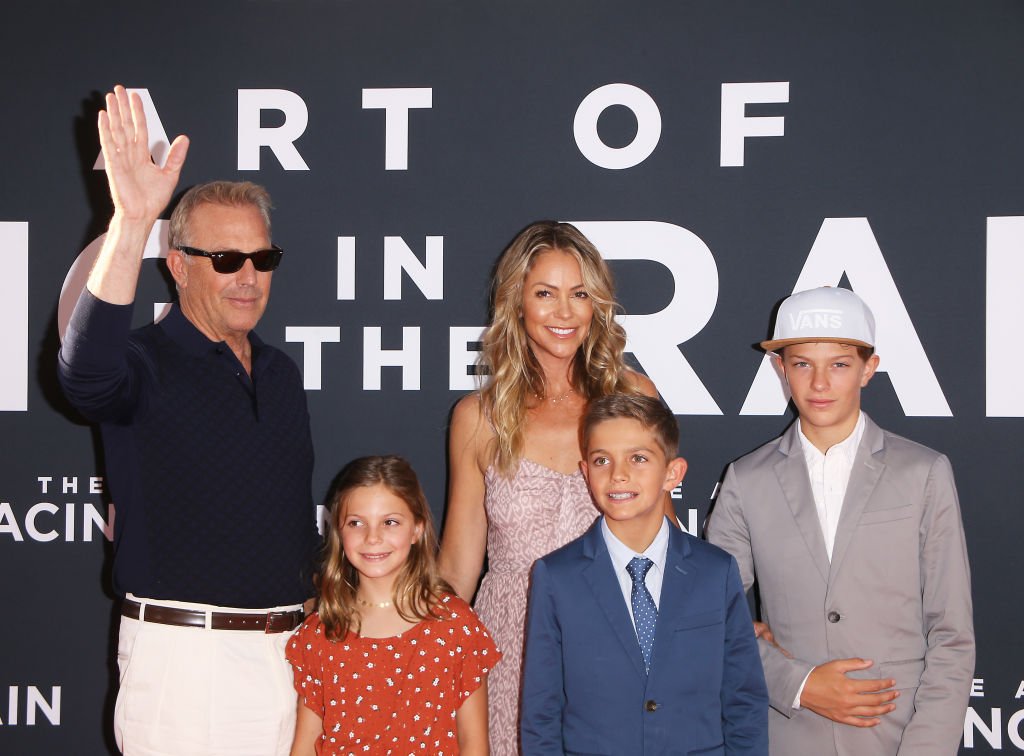 Image Credit: Getty Images / Grace Avery Costner, Kevin Costner, Hayes Logan Costner, Christine Baumgartner, and Cayden Wyatt Costner attend the premiere of 20th Century Fox's "The Art of Racing in the Rain" at El Capitan Theatre on August 01, 2019. Image Credit: Getty Images / Grace Avery Costner, Kevin Costner, Hayes Logan Costner, Christine Baumgartner, and Cayden Wyatt Costner attend the premiere of 20th Century Fox's "The Art of Racing in the Rain" at El Capitan Theatre on August 01, 2019.
