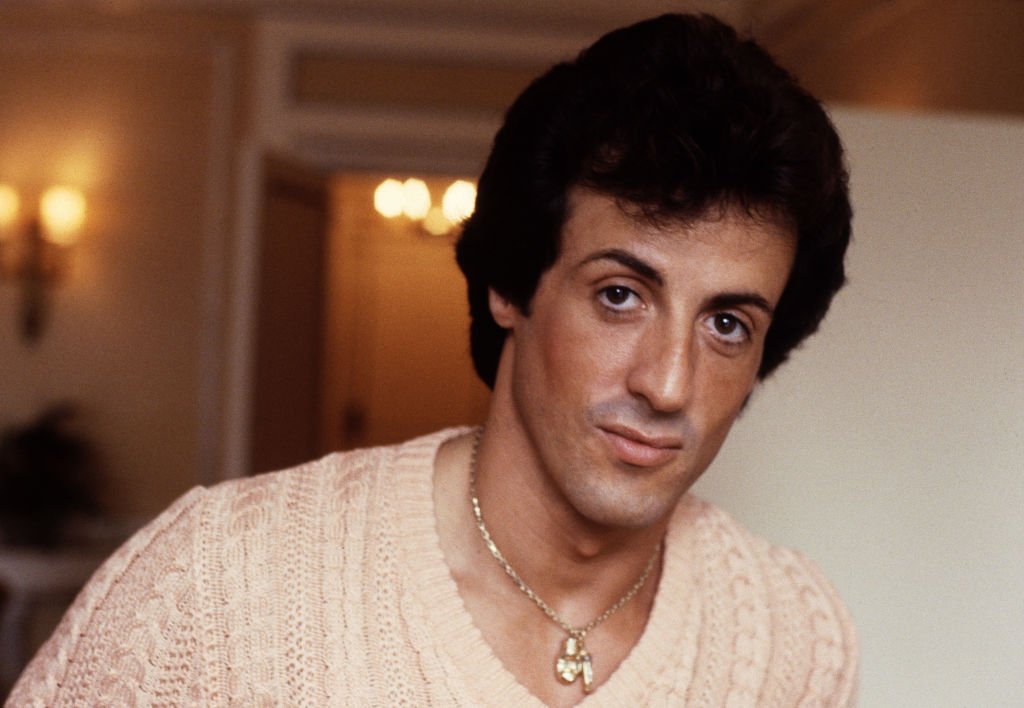 Image Source: Getty Images/Michael Putland | Photo of Stallone circa 1982