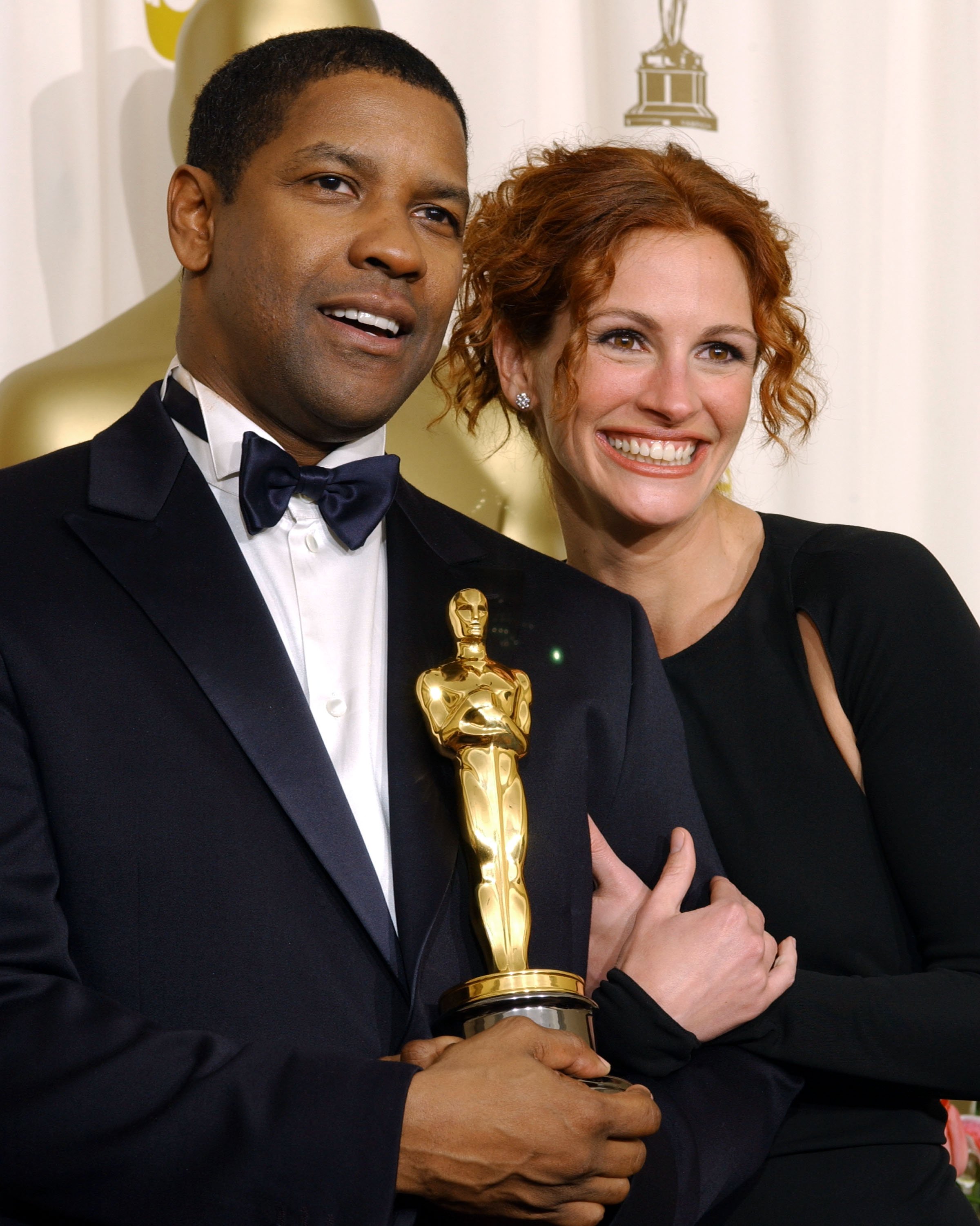 Image Credits: Getty Images | Denzel Washington next to Julia Roberts
