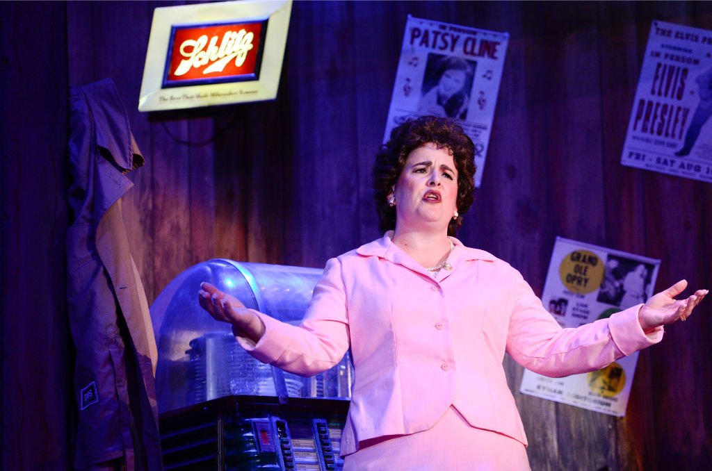 Image Credit: Getty Images / Melissa Swift-Sawyer, playing Patsy Cline, sings during a performance of Always Patsy Cline on Thursday at the Candlelight Dinner Playhouse.