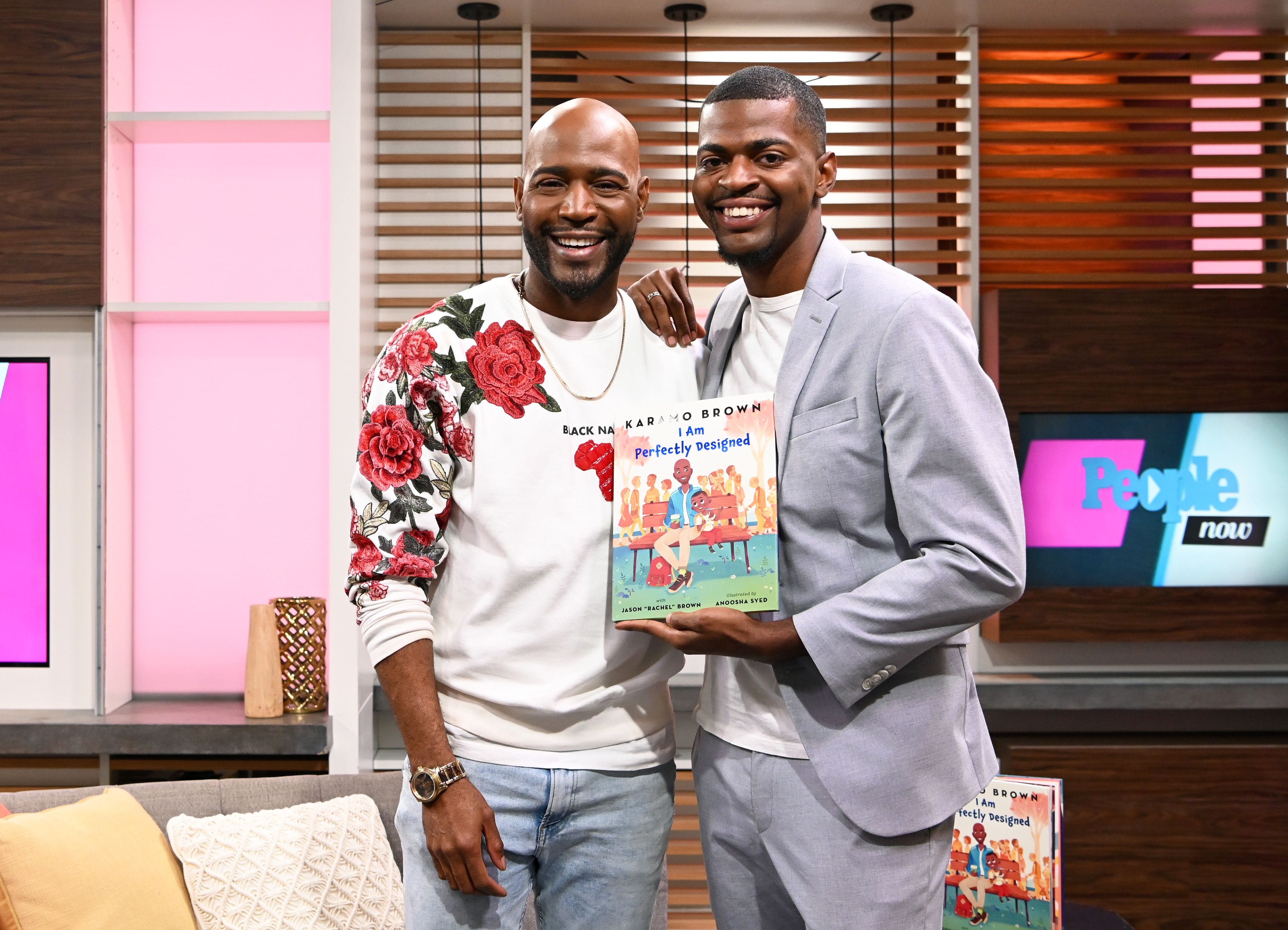 Karamo Brown and his son Jason Brown pose with their new book "I am Perfectly Designed" / Getty Images Karamo Brown and his son Jason Brown pose with their new book "I am Perfectly Designed" / Getty Images
