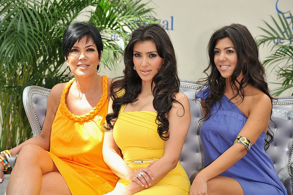 Image Credit: Getty Images / Kim Kardashian (C) with her mother Kris (L) and sister Kourtney promoting the television series "Keeping Up With the Kardashians" during the 2008 Monte Carlo Television Festival.