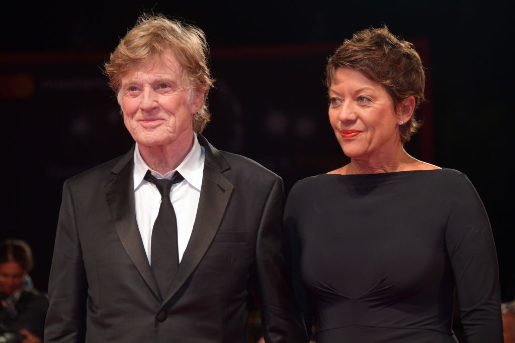 Image Credits: Getty Images / Dominique Charriau / WireImage | Robert Redford and Sibylle Szaggars walk the red carpet ahead of the 'Our Souls At Night' screening during the 74th Venice Film Festival at Sala Grande on September 1, 2017 in Venice, Italy.