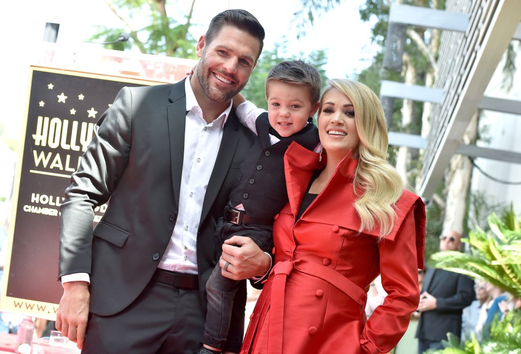 Image Credit: Getty Images / Musician Carrie Underwood, husband Mike Fisher and son Isaiah Michael Fisher at Carrie Underwood Star Ceremony On The Hollywood Walk Of Fame held on September 20, 2018 in Hollywood.