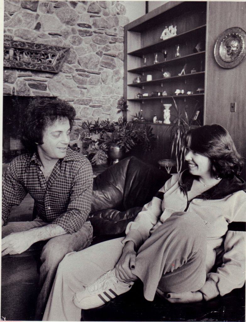 Image Credits: Getty Images / Dick Kraus / Newsday RM | Musician Billy Joel and his wife and manager Elizabeth Weber at their home in Cove Neck on December 20, 1978. Image Credits: Getty Images / Dick Kraus / Newsday RM | Musician Billy Joel and his wife and manager Elizabeth Weber at their home in Cove Neck on December 20, 1978.