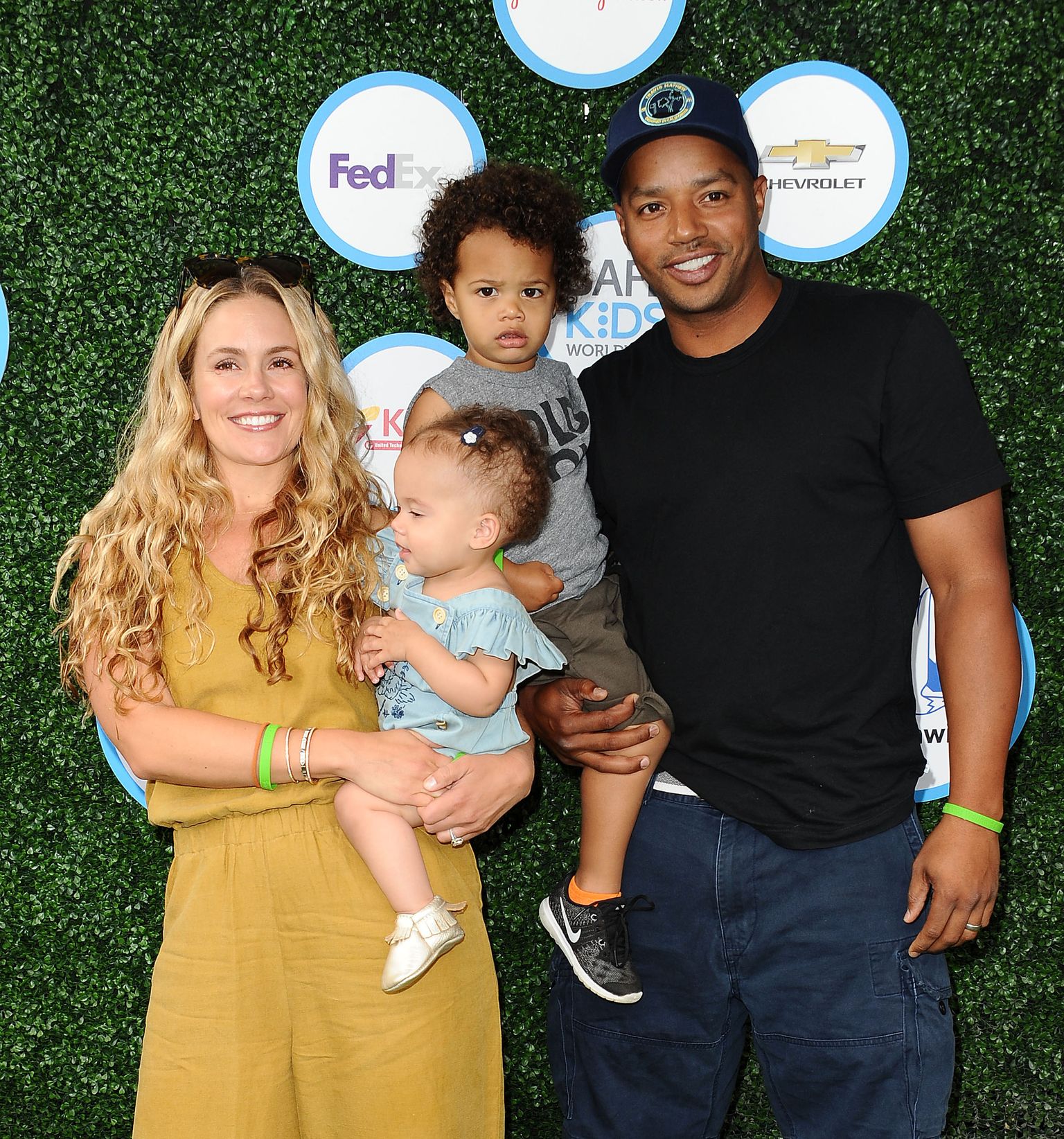 CaCee Cobb, Donald Faison, Wilder Frances Faison and Rocco Faison attend Safe Kids Day / Getty Images