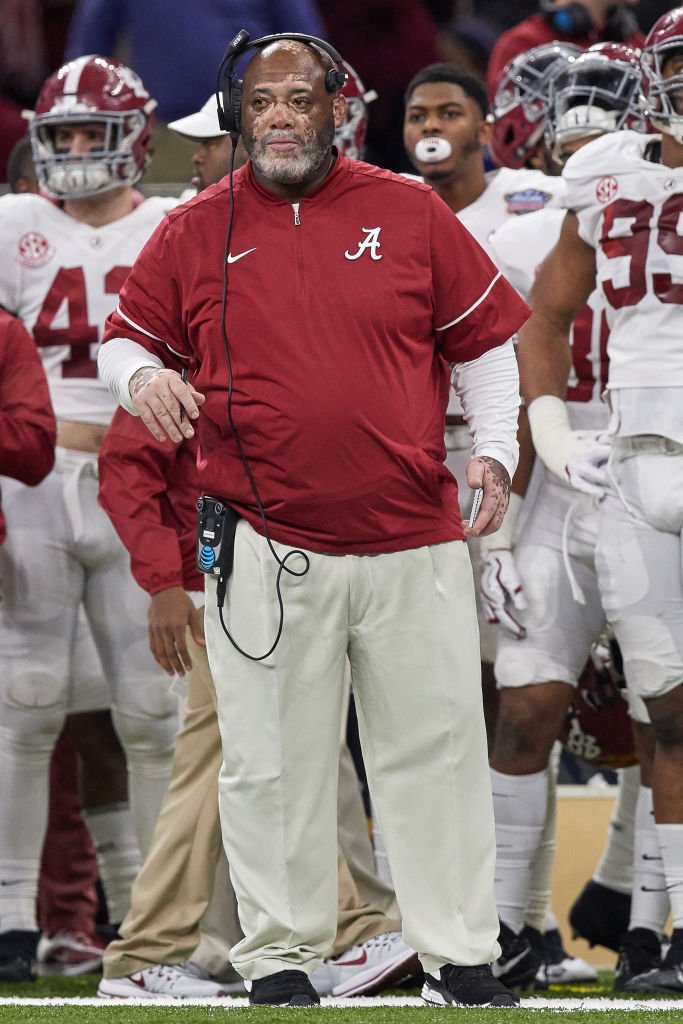 Image Credits: Getty Images / Robin Alam / Icon Sportswire | Alabama Crimson Tide defensive line coach Karl Dunbar looks on during the College Football Playoff Semifinal at the Allstate Sugar Bowl between the Alabama Crimson Tide and Clemson Tigers on January 1, 2018, at the Mercedes-Benz Superdome in New Orleans, LA.