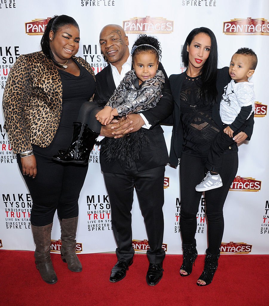 Image Source: Getty Images/Gregg DeGuire/Mike Tyson (C), daughters Mikey Tyson, Milan Tyson, wife Kiki Tyson and son Morocco Tyson arrive at the Los Angeles opening night of "Mike Tyson - Undisputed Truth" at the Pantages Theatre on March 8, 2013 in Hollywood, California