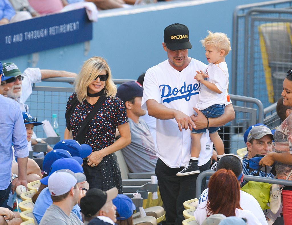 Image Credit: Getty Images / Fergie, Josh Duhamel and Axl Jack Duhamel attend a baseball game at Dodger Stadium on August 7, 2016 in Los Angeles.