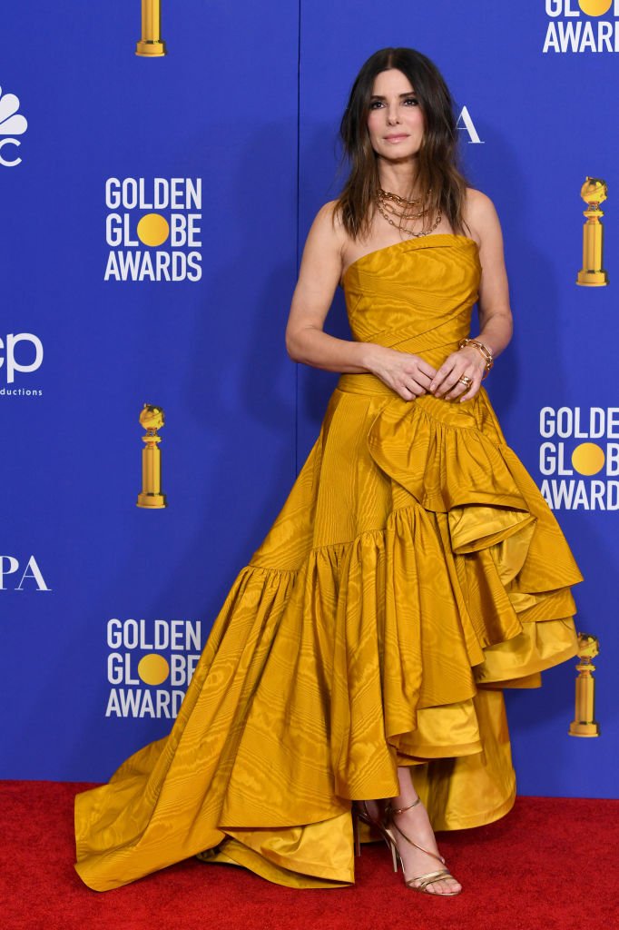 Image Credits: Getty Images / Kevin Winter | Sandra Bullock poses in the press room during the 77th Annual Golden Globe Awards at The Beverly Hilton Hotel on January 05, 2020 in Beverly Hills, California.