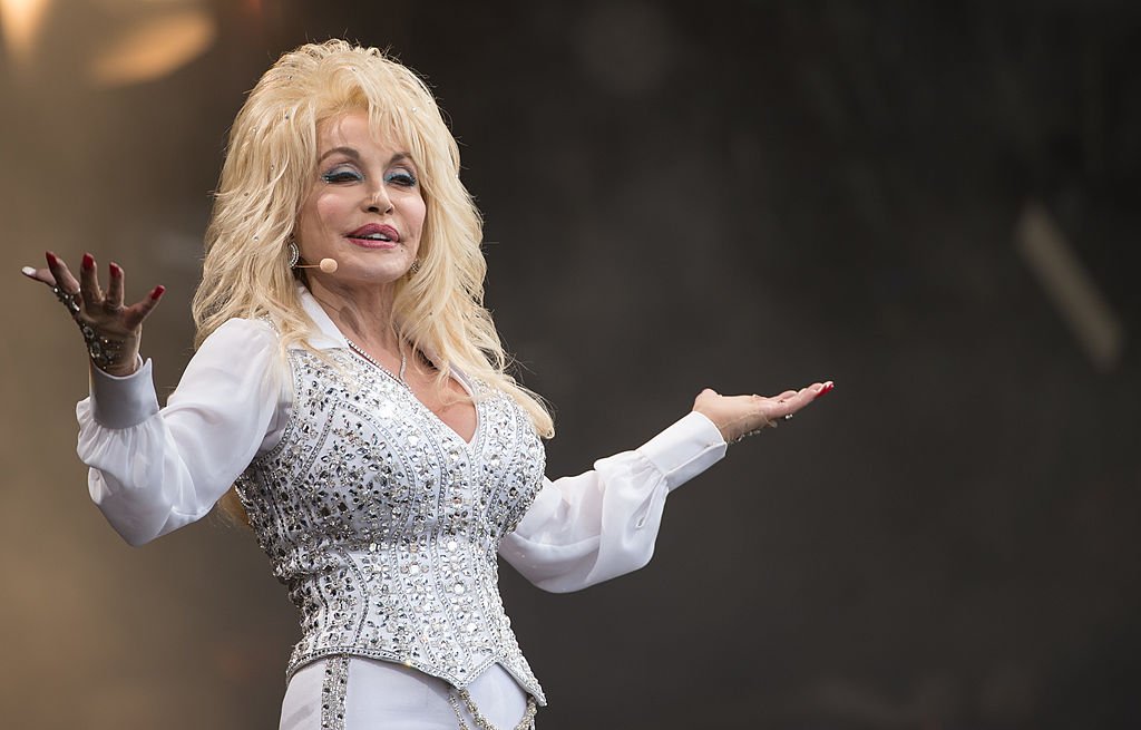Image Credits: Getty Images / Ian Gavan | Dolly Parton performs on the Pyramid Stage during Day 3 of the Glastonbury Festival at Worthy Farm on June 29, 2014 in Glastonbury, England. Image Credits: Getty Images / Ian Gavan | Dolly Parton performs on the Pyramid Stage during Day 3 of the Glastonbury Festival at Worthy Farm on June 29, 2014 in Glastonbury, England.