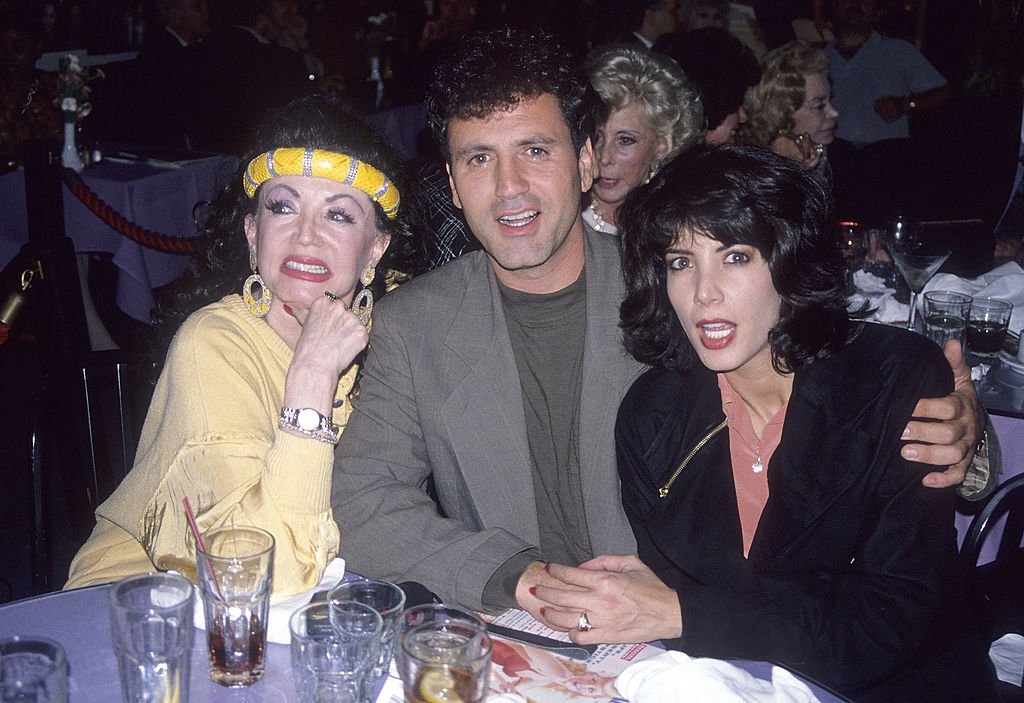 Image Credits: Getty Images / Ron Galella, Ltd. / Ron Galella Collection | Jackie Stallone, son Frank Stallone and daughter Toni-Ann Filiti attend Party to Celebrate Joe Franklin's Nostalgia Magazine's September 1990 Issue on August 16, 1990 at Ciro's Pomodor Restaurant in West Hollywood, California.