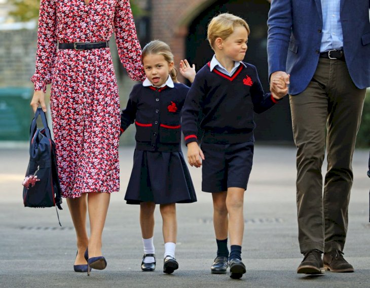 Image Credit: Getty Images / rincess Charlotte, waves as she arrives for her first day at school, with her brother Prince George and her parents.