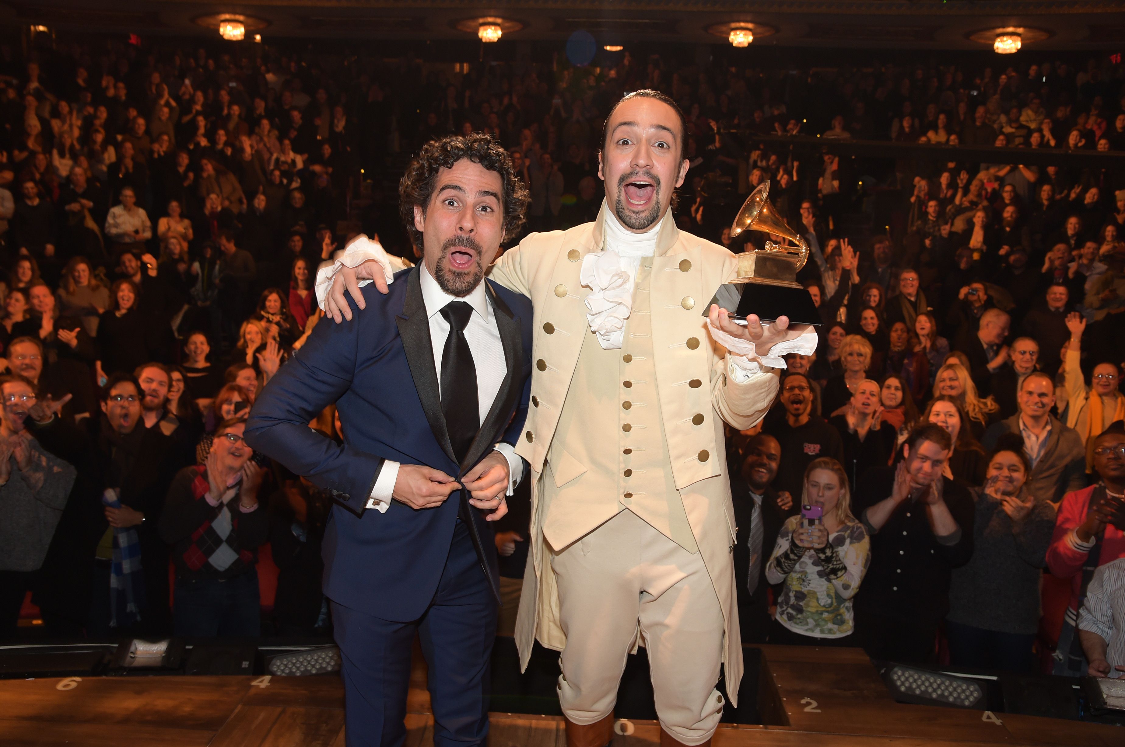 Music director Alex Lacamoire and Actor, composer Lin-Manuel Miranda celebrate on stage during "Hamilton" GRAMMY performance / Getty Images