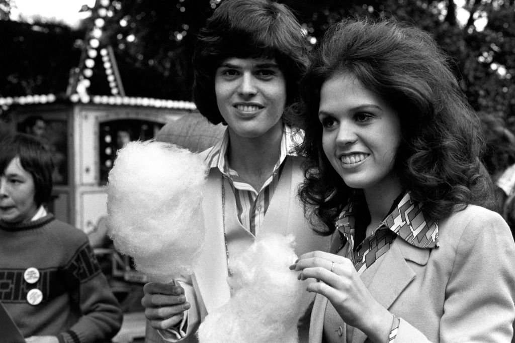 Image Credit: Getty Images / Marie Osmond with her brother Donny relaxing with candy floss at Richmond Fellowship in honour of the Osmonds group.