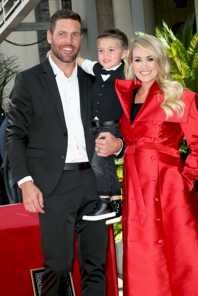 Image Credit: Getty Images/David Livingston | Underwood, Fisher and their son at Carrie's Hollywood Walk of Fame Star unveiling