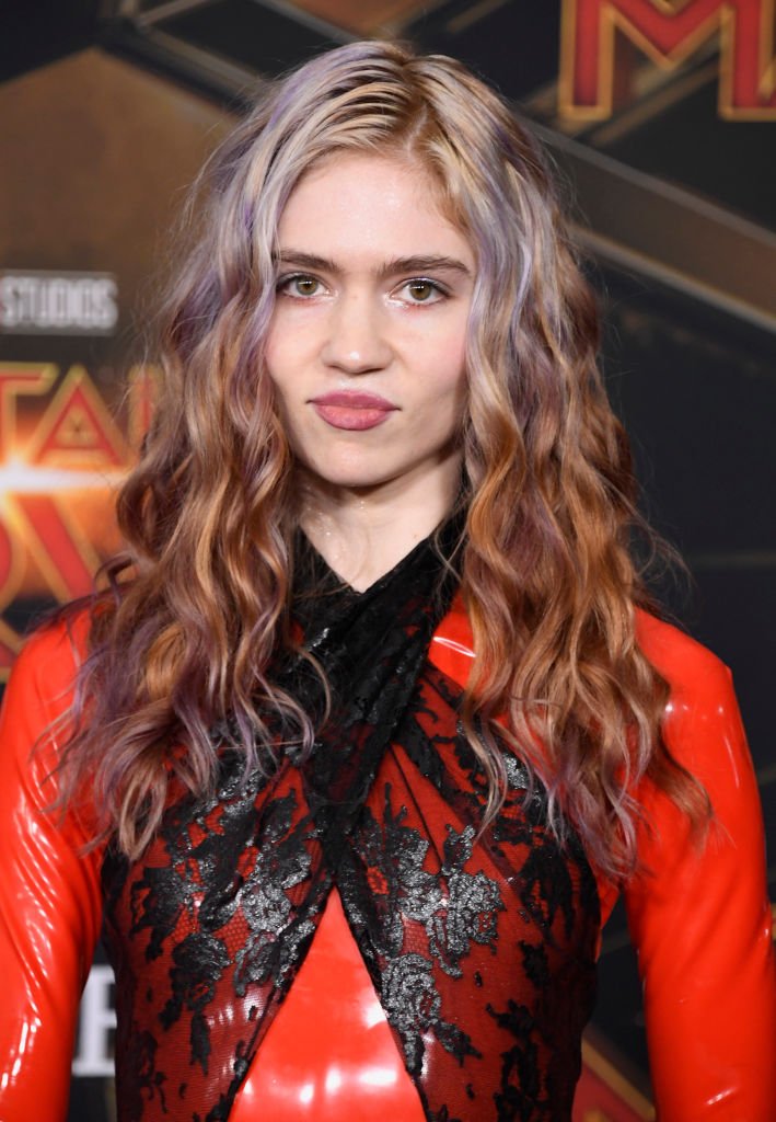 Image Credit: Getty Images / Grimes attends the Marvel Studios "Captain Marvel" premiere on March 04, 2019 in Hollywood, California.