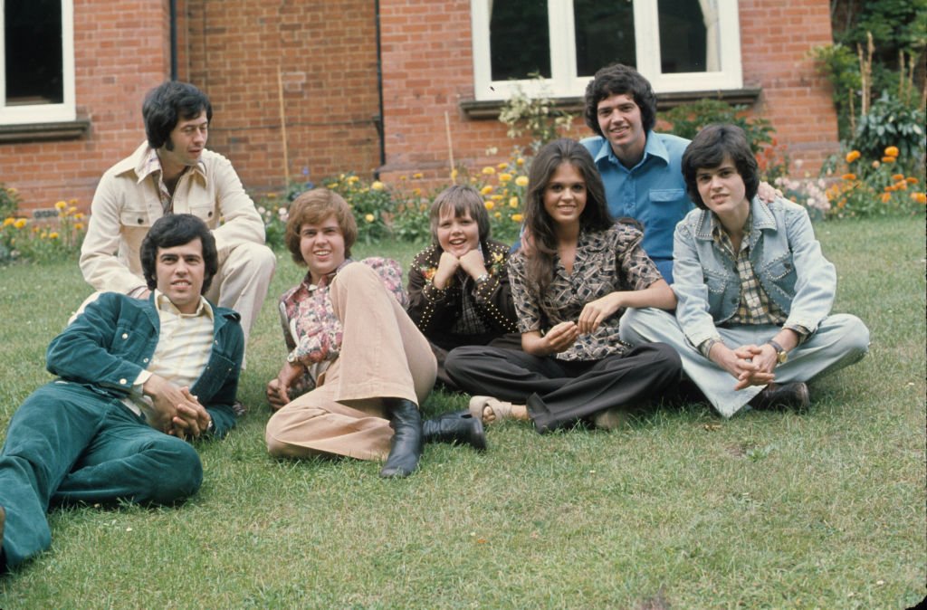 Image Credit: Getty Images / The Osmonds, Wayne, Jay, Merrill, Jimmy, Marie, Alan and Donny during a visit to the UK circa 1974 in England.