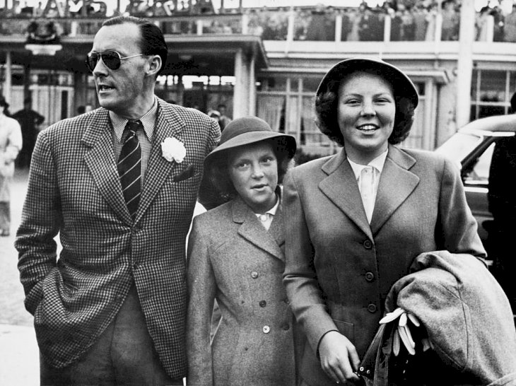 Image Credit: Getty Images / Princess Beatrix (right), later Queen Beatrix of the Netherlands, and her sister Princess Irene arrive at Amsterdam airport after a holiday in Canada and the USA, and are met by their father, Prince Bernhard.