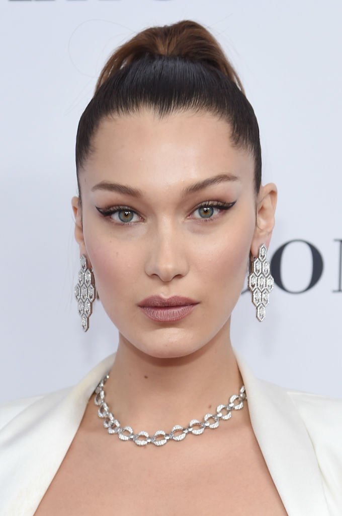 Image Credit: Getty Images / Supermodel Bella Hadid poses for a picture on the red carpet.